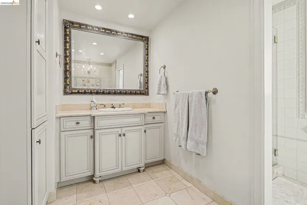 a bathroom with a double vanity sink mirror and