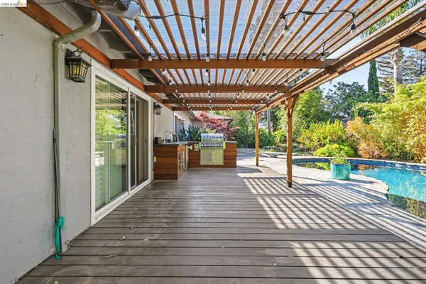 a view of a porch with wooden floor