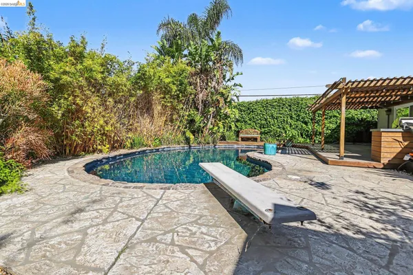 a view of a swimming pool with a patio