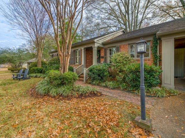4309 Sequoia Road Memphis, TN 38117 - Photo 2 of 25 a front view of a house with garden