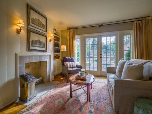 4309 Sequoia Road Memphis, TN 38117 - Photo 13 of 25 a living room with fireplace furniture and a large window