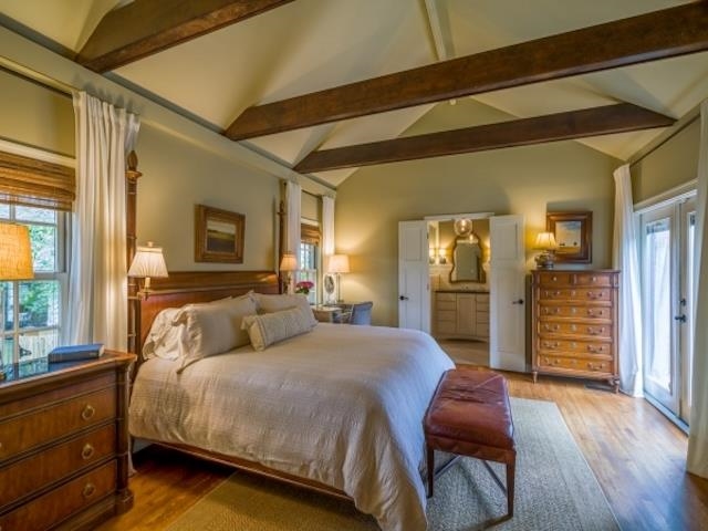 4309 Sequoia Road Memphis, TN 38117 - Photo 17 of 25 a bedroom with a bed and wooden floor