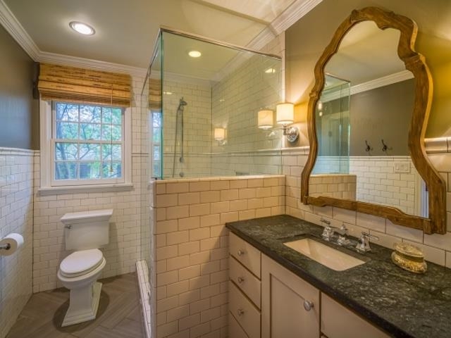 4309 Sequoia Road Memphis, TN 38117 - Photo 19 of 25 a bathroom with a granite countertop sink toilet and shower