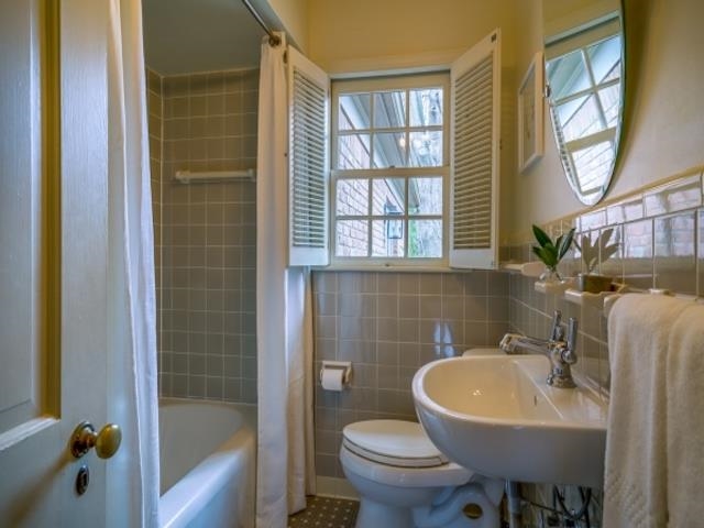 4309 Sequoia Road Memphis, TN 38117 - Photo 21 of 25 a bathroom with a sink a toilet and a mirror