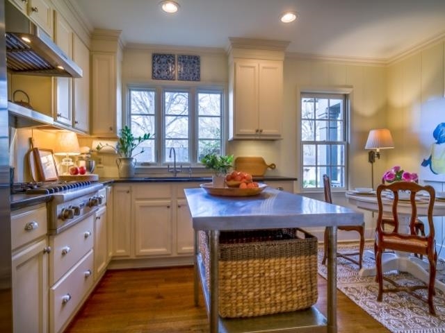 4309 Sequoia Road Memphis, TN 38117 - Photo 5 of 25 a kitchen with a stove a table and chairs