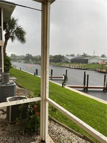 a view of a lake with a yard and a ocean view