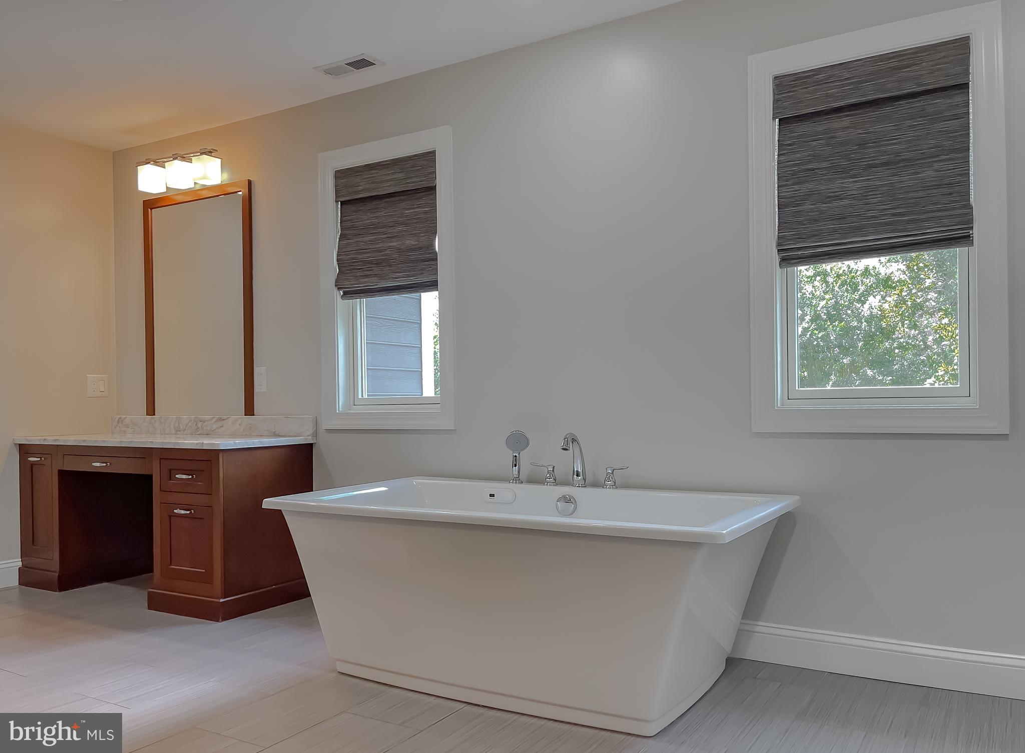 24754 Half Pone Point Road Hollywood, MD 20636 - Photo 107 of 137 a spacious bathroom with a bathtub and a sink