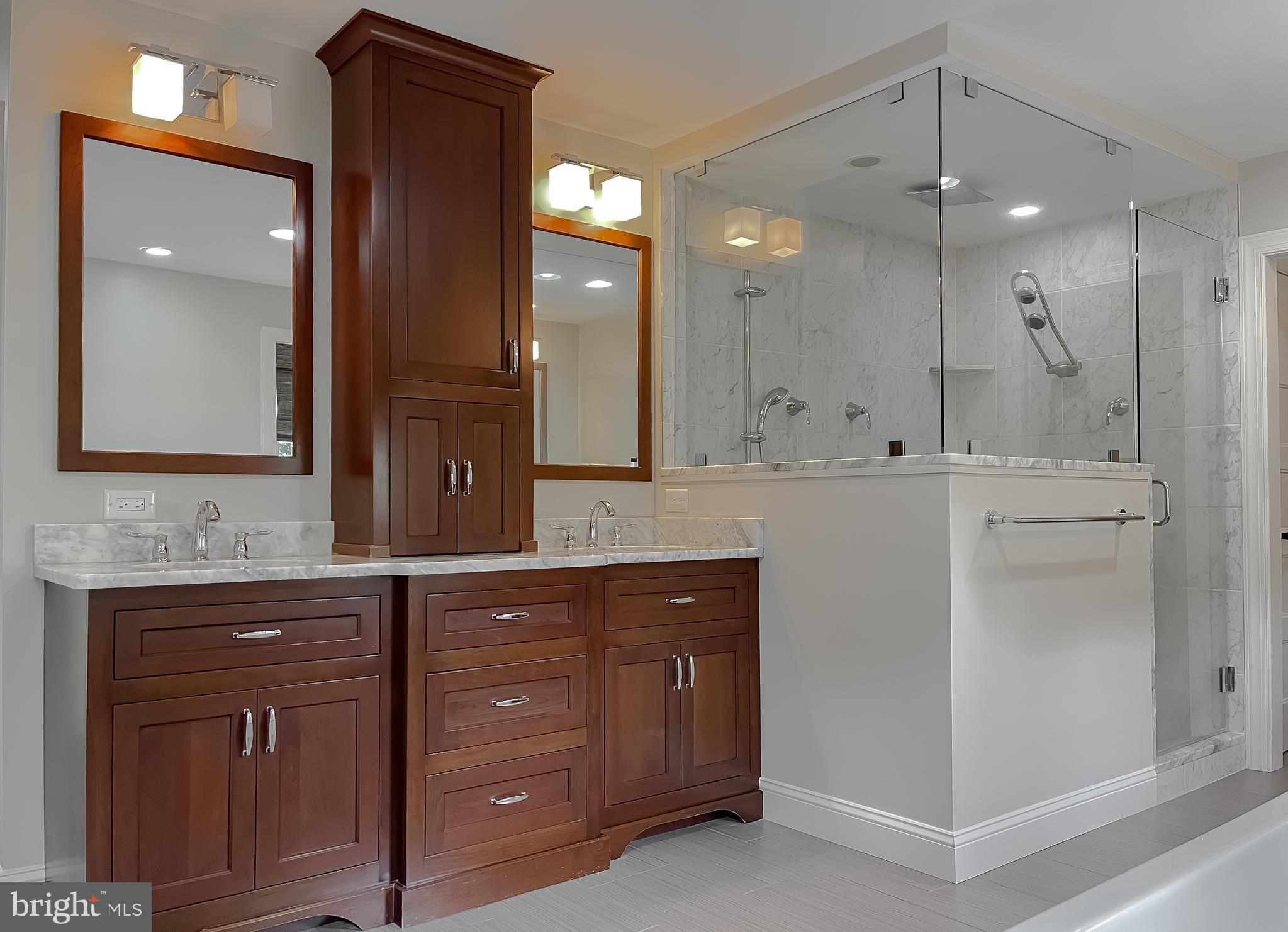 24754 Half Pone Point Road Hollywood, MD 20636 - Photo 108 of 137 a spacious bathroom with a granite countertop sink a mirror and a