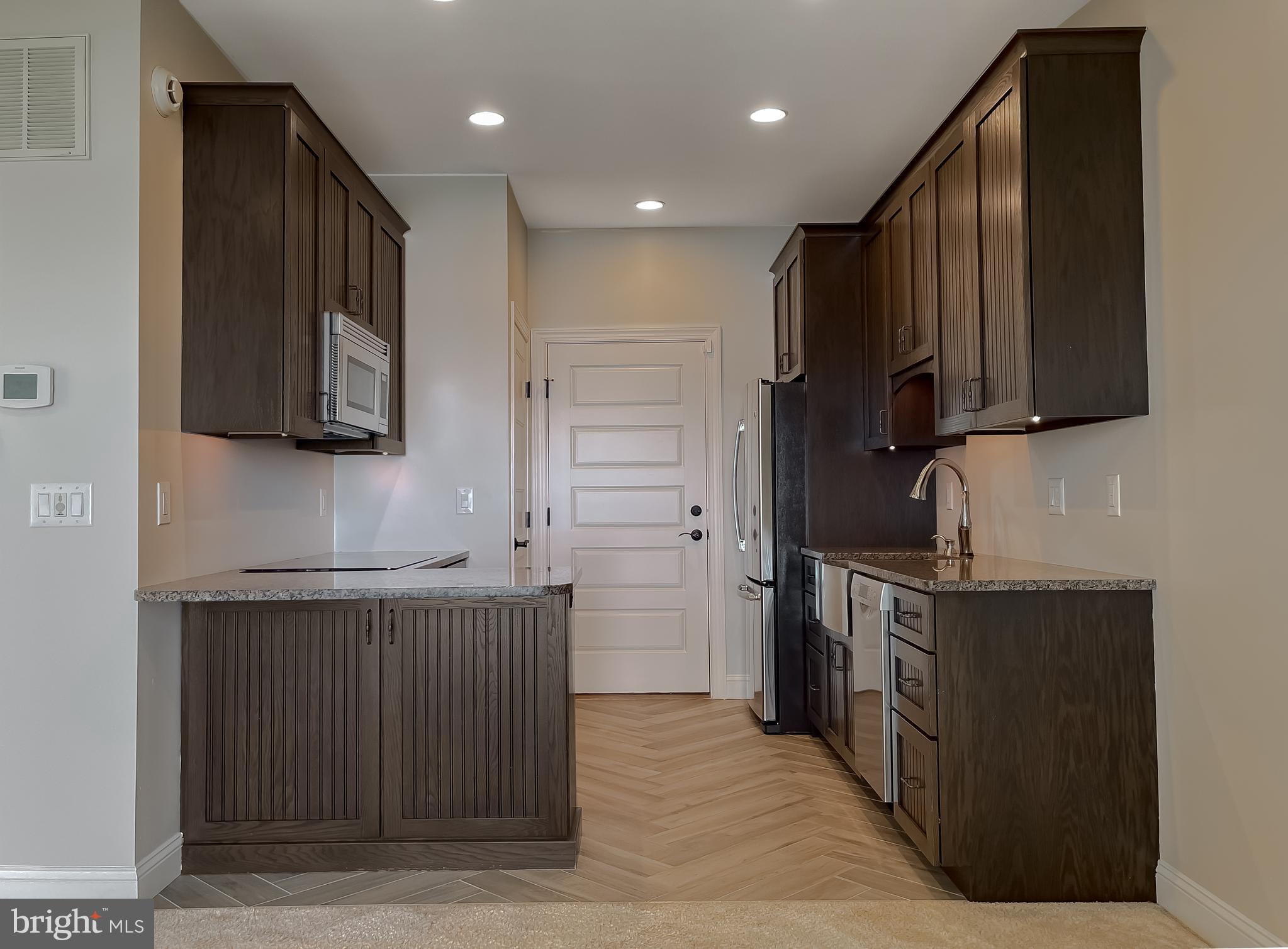 24754 Half Pone Point Road Hollywood, MD 20636 - Photo 120 of 137 a kitchen with stainless steel appliances granite countertop a stove a sink and a refrigerator