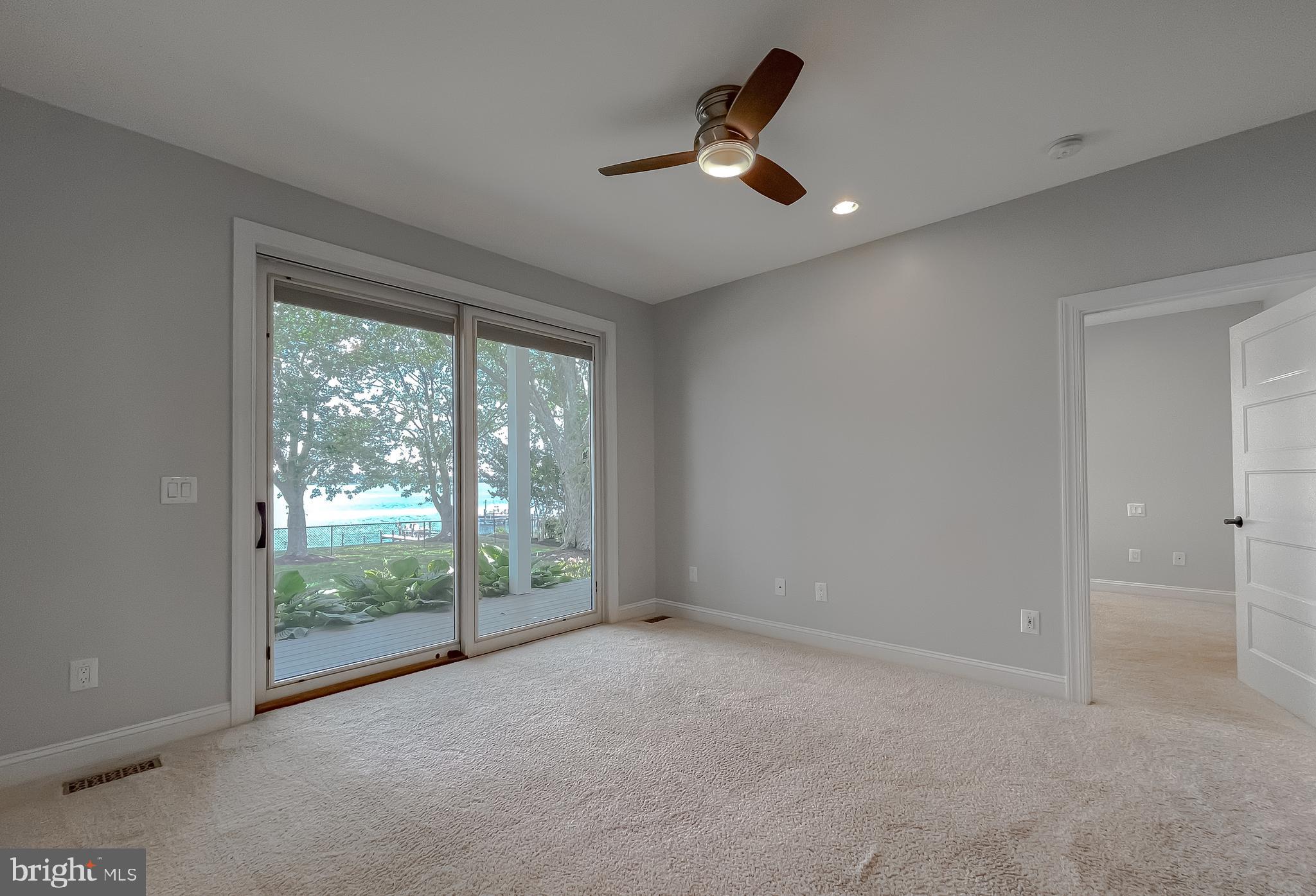24754 Half Pone Point Road Hollywood, MD 20636 - Photo 124 of 137 a view of a livingroom with a ceiling fan and window