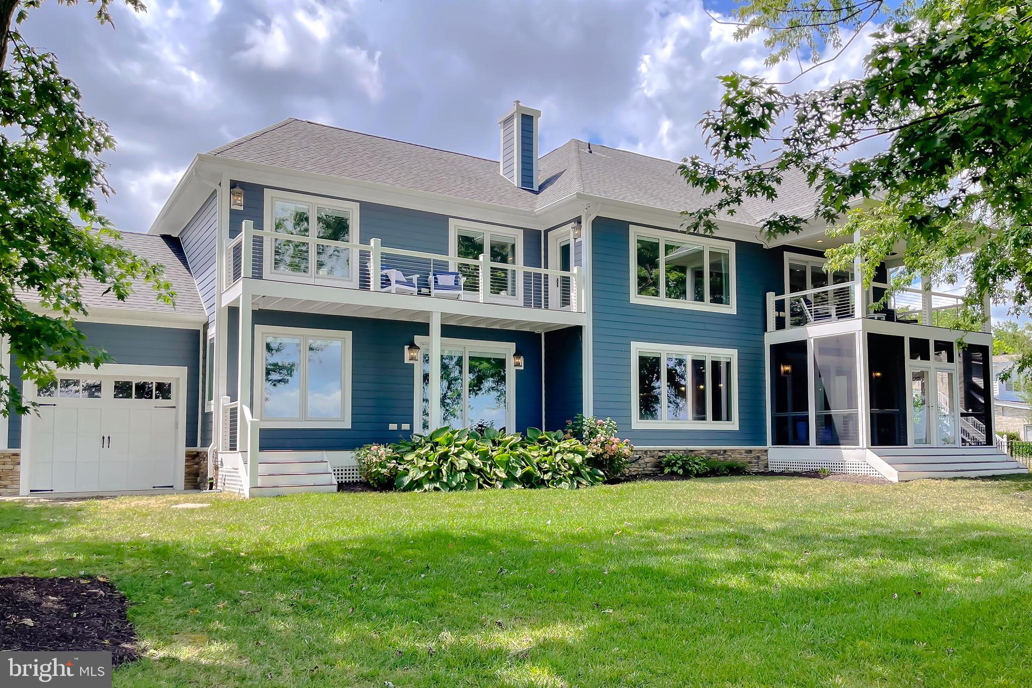 24754 Half Pone Point Road Hollywood, MD 20636 - Photo 15 of 137 a front view of a house with a yard
