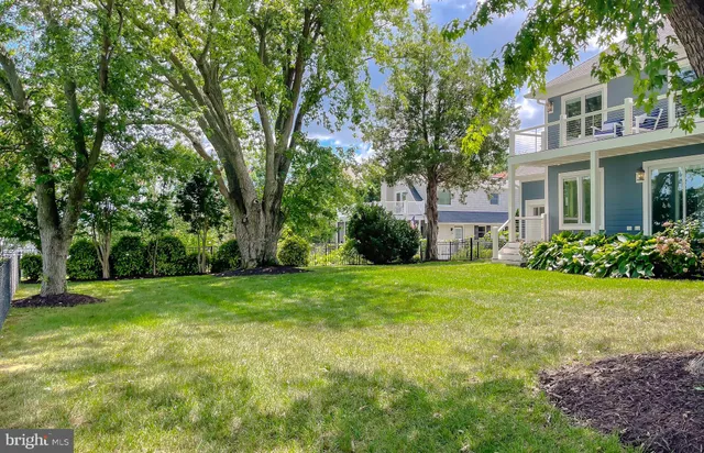 a kitchen with granite countertop and stainless steel appliances and cabinets