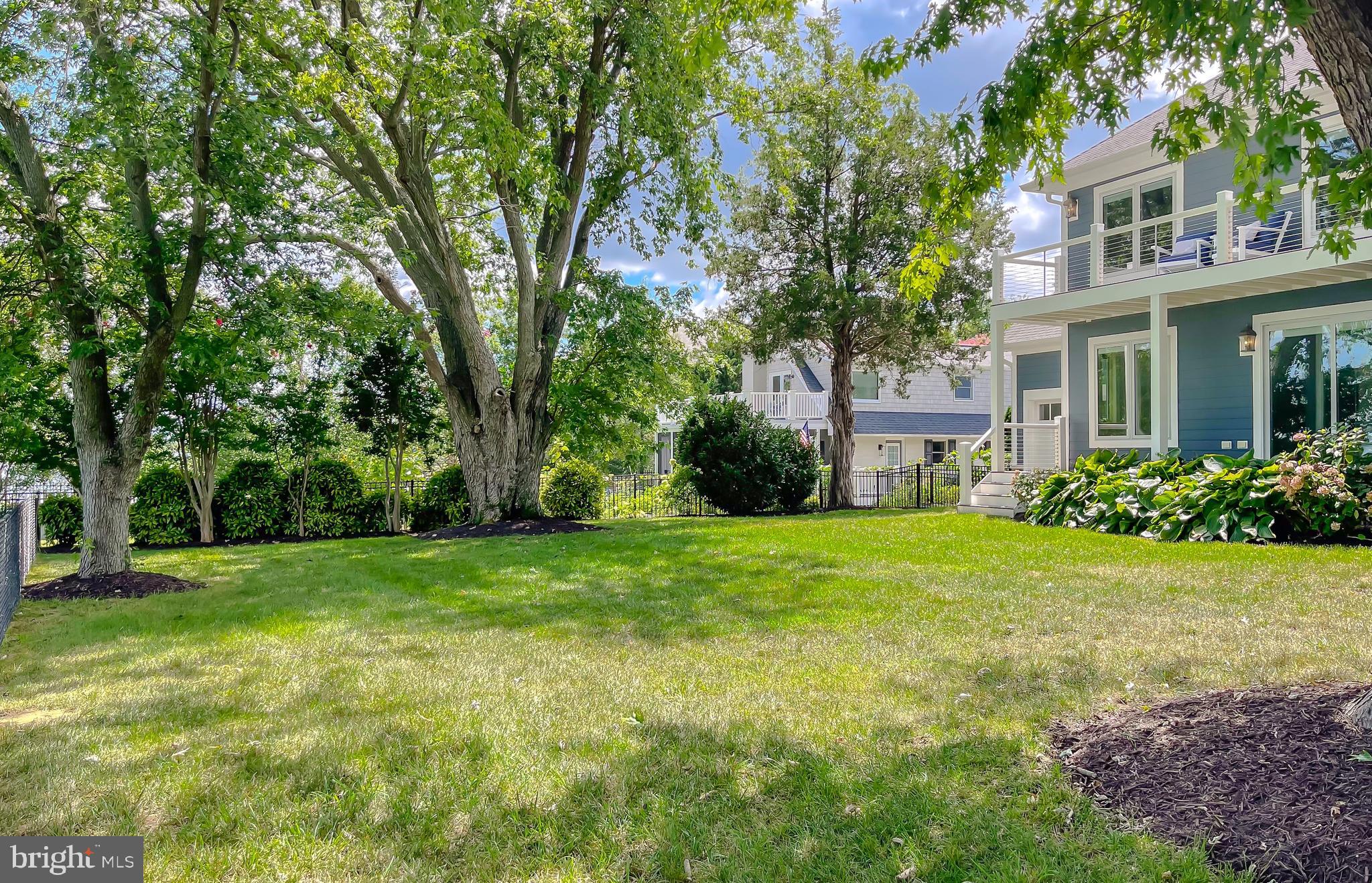 24754 Half Pone Point Road Hollywood, MD 20636 - Photo 19 of 137 a view of a big yard with plants and large trees