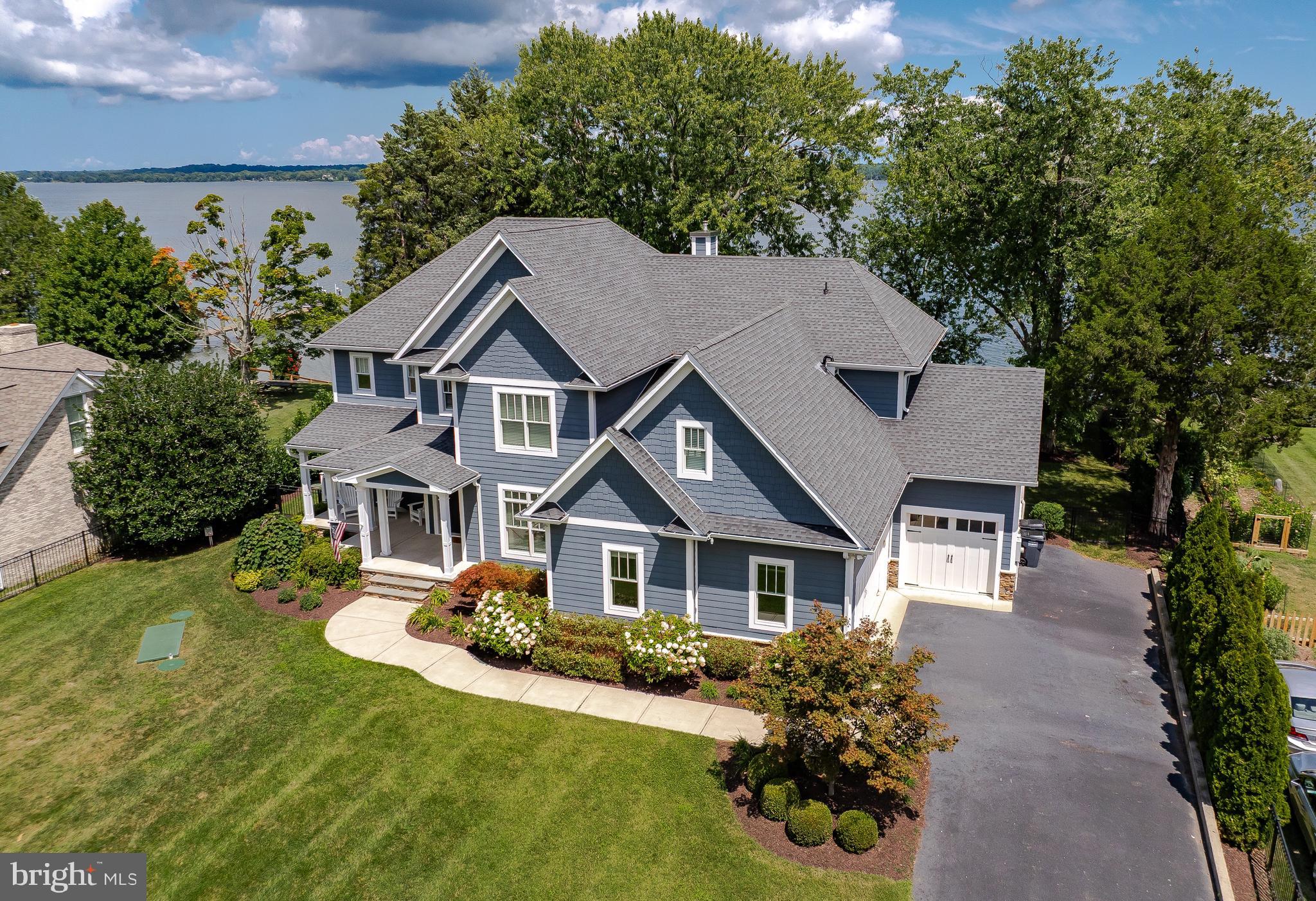 24754 Half Pone Point Road Hollywood, MD 20636 - Photo 2 of 137 a front view of a house with a yard