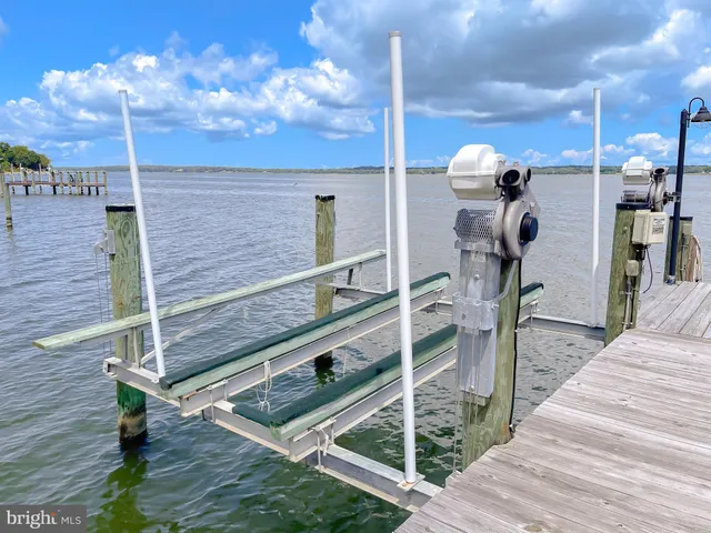 a view of a porch with wooden floor and outdoor space