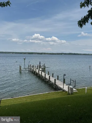 a view of a livingroom with an empty space and a large window