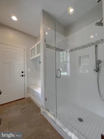 a kitchen with stainless steel appliances a refrigerator and a stove