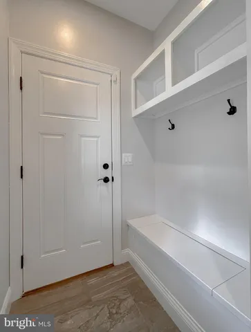 a view of a livingroom with a ceiling fan and window