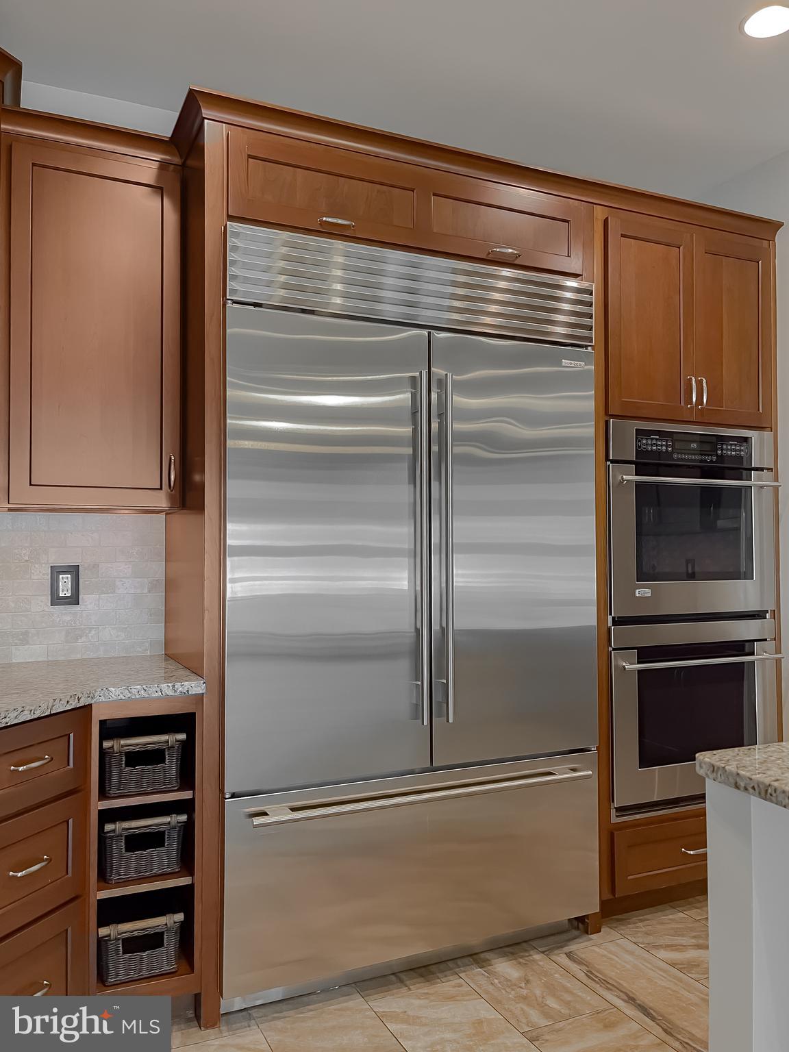 24754 Half Pone Point Road Hollywood, MD 20636 - Photo 56 of 137 a kitchen with granite countertop and stainless steel appliances and cabinets