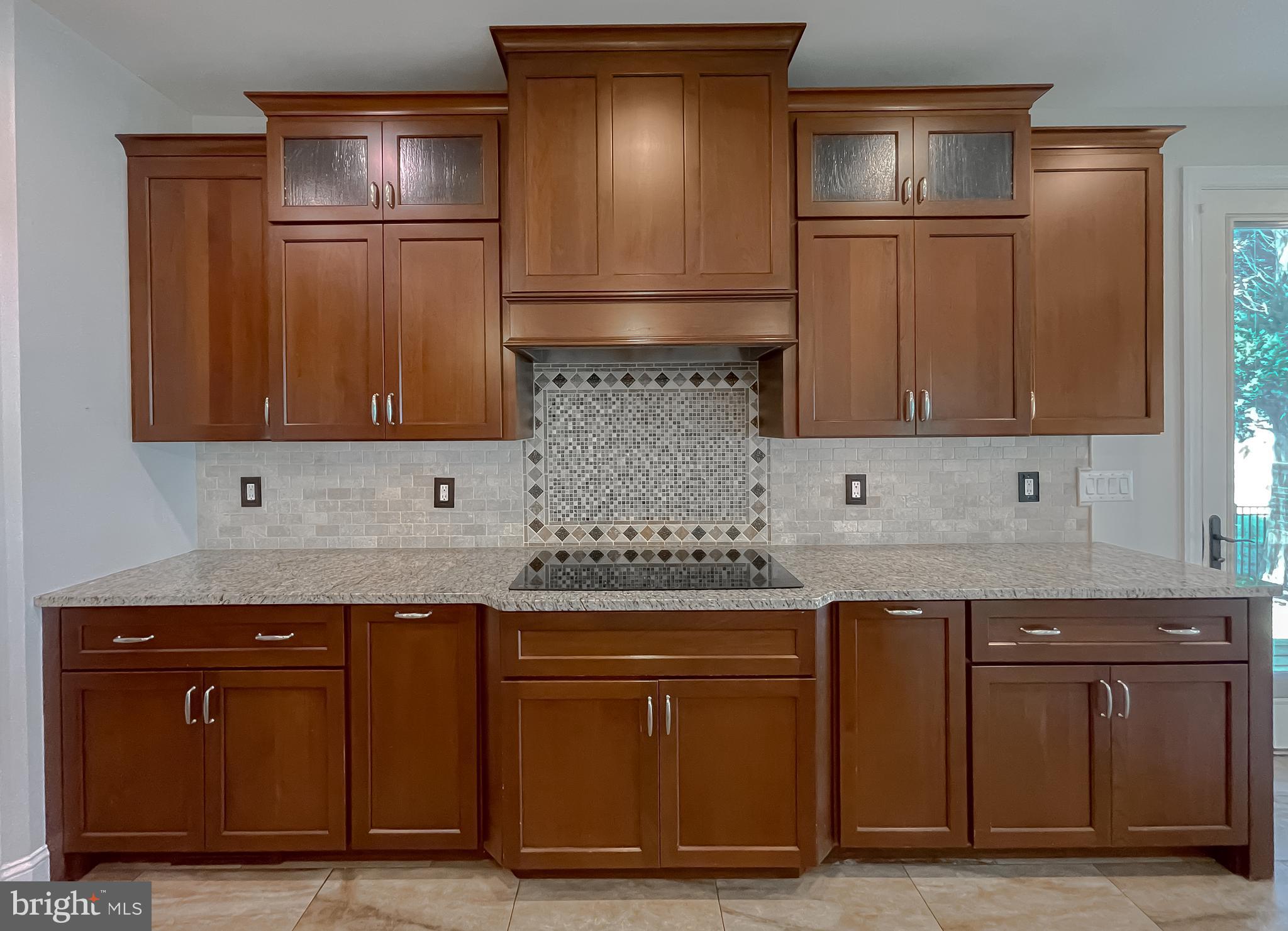 24754 Half Pone Point Road Hollywood, MD 20636 - Photo 58 of 137 a kitchen with granite countertop a sink and cabinets