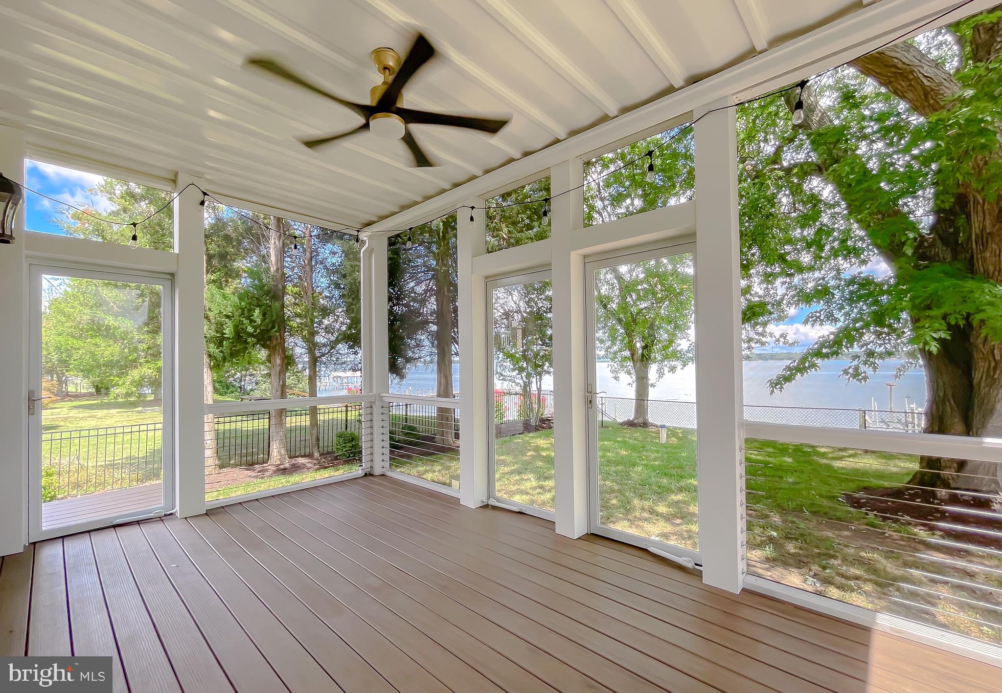 24754 Half Pone Point Road Hollywood, MD 20636 - Photo 66 of 137 a view of a porch with wooden floor and outdoor space