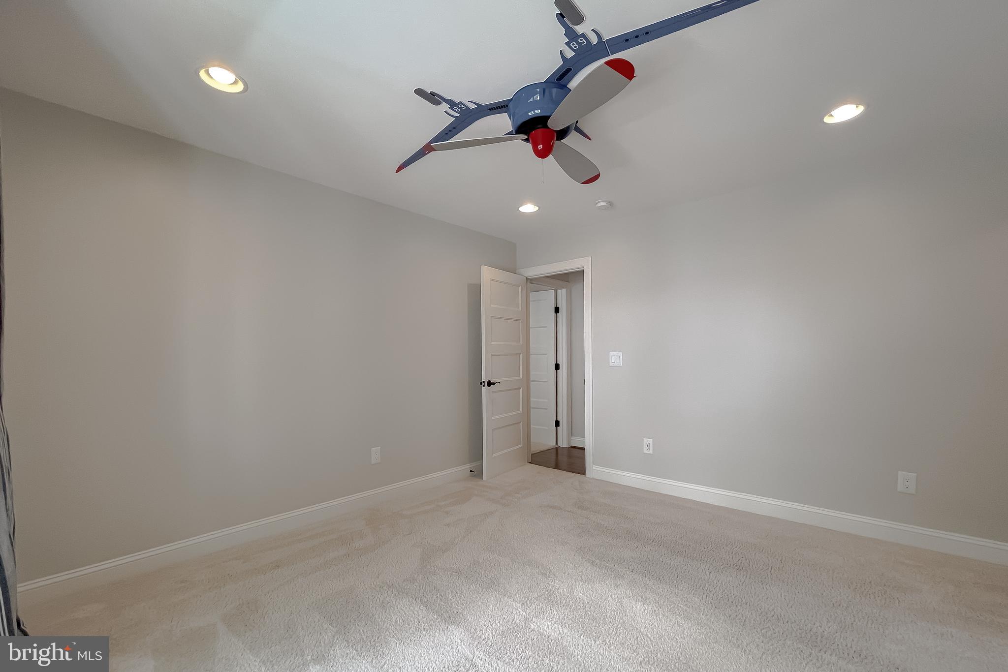 24754 Half Pone Point Road Hollywood, MD 20636 - Photo 78 of 137 an empty room with a ceiling fan and a window