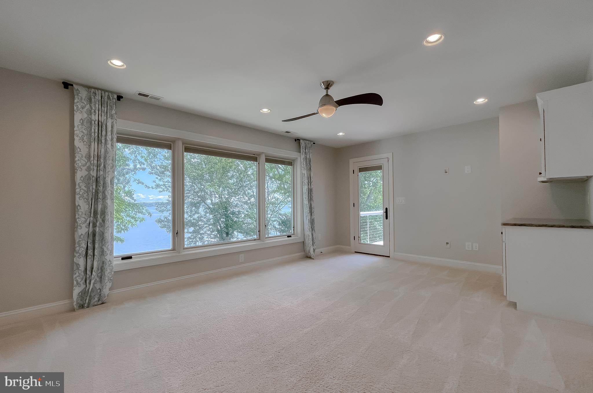24754 Half Pone Point Road Hollywood, MD 20636 - Photo 91 of 137 a view of a livingroom with an empty space and a large window