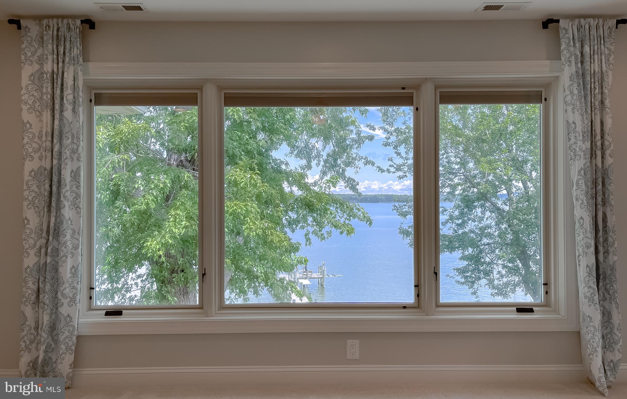 24754 Half Pone Point Road Hollywood, MD 20636 - Photo 95 of 137 a view of a room that has a window and a bed