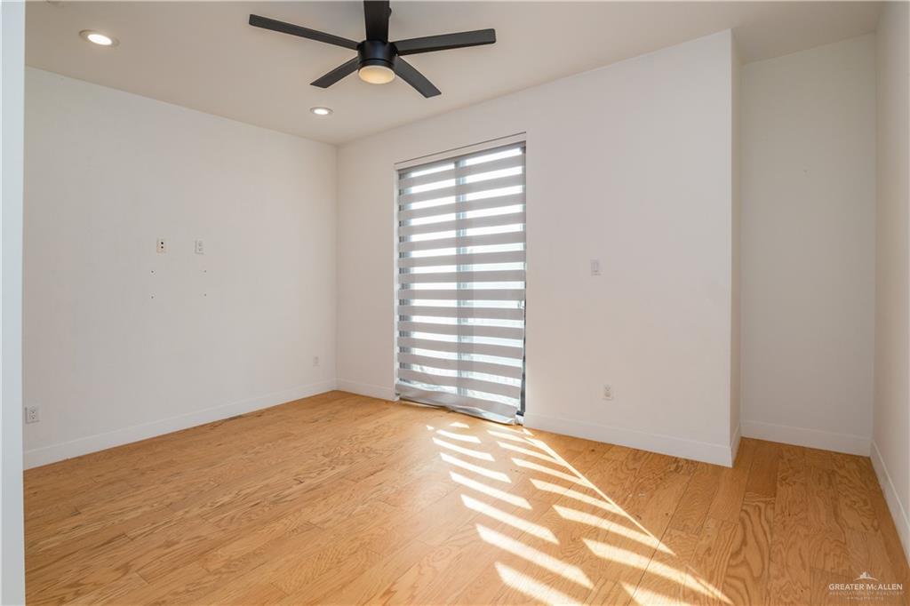 915 Santa Lucia Street Mission, TX 78572 - Photo 11 of 23 Empty room with light wood-type flooring, recessed lighting, and ceiling fan