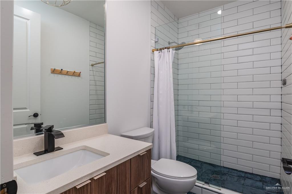 915 Santa Lucia Street Mission, TX 78572 - Photo 20 of 23 Full bath featuring vanity and a stall shower