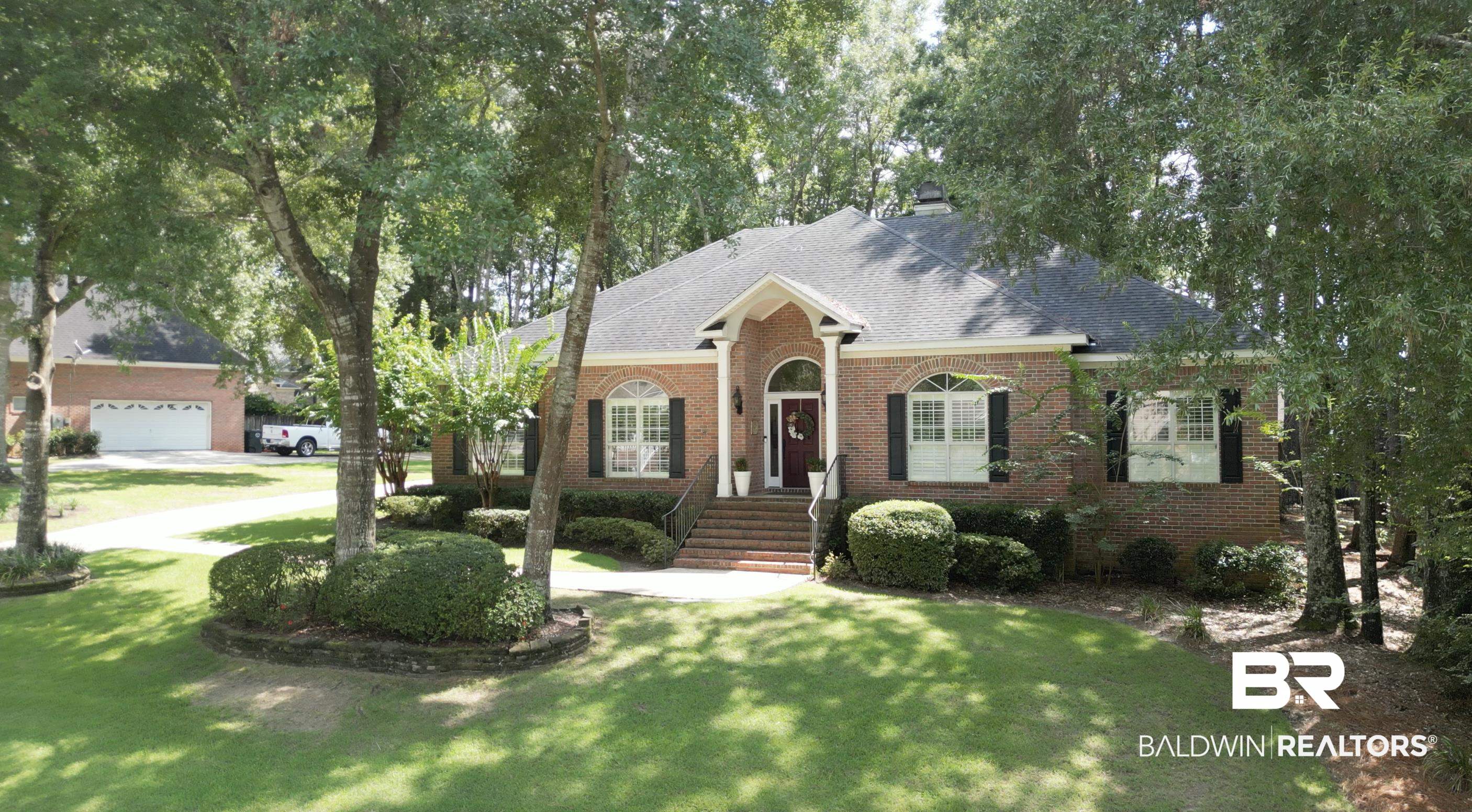 105 Beaver Dam Road Fairhope, AL 36532 - Photo 53 of 55 View of front facade with a garage and a front yard