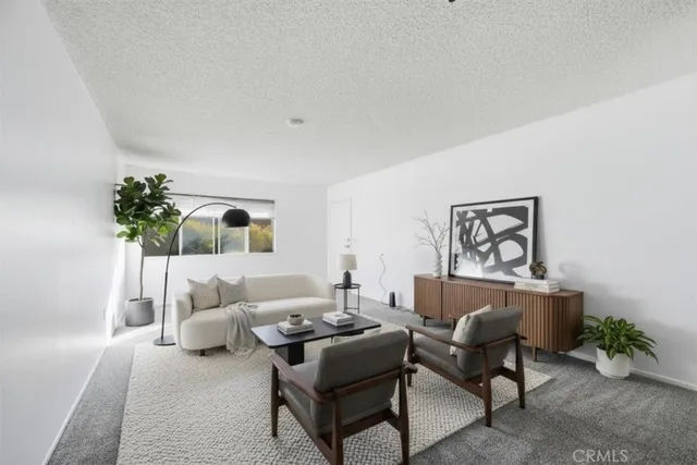 a living room with furniture and flowers