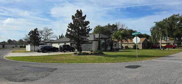 a view of a car parked in front of a house