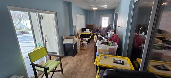 a view of a children room with wooden floor and windows