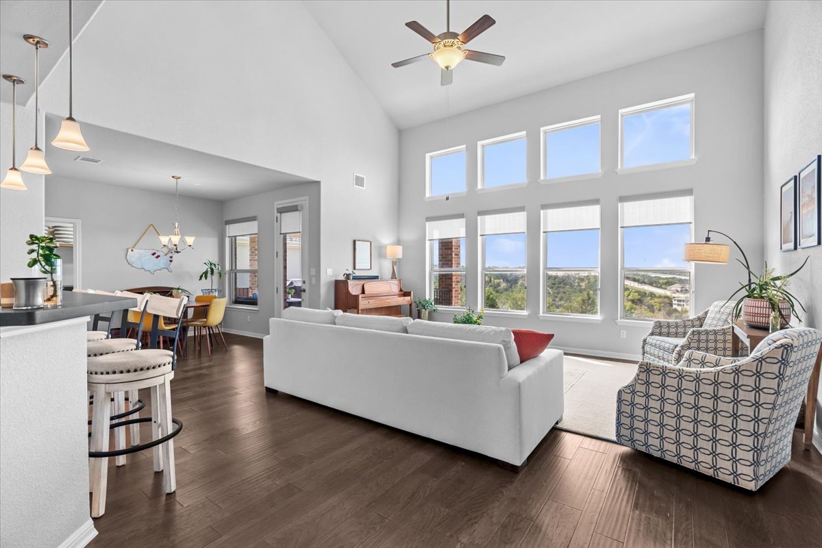 2733 Painted Sky Bend Leander, TX 78641 - Photo 15 of 35 a living room with furniture and floor to ceiling windows