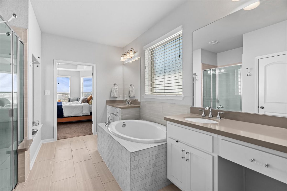 2733 Painted Sky Bend Leander, TX 78641 - Photo 20 of 35 a en suite bathroom with a sink double vanity