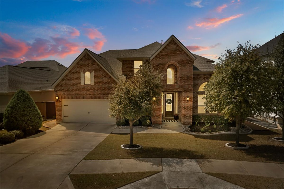 2733 Painted Sky Bend Leander, TX 78641 - Photo 2 of 35 a front view of a house with garden