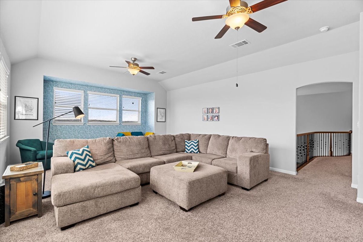 2733 Painted Sky Bend Leander, TX 78641 - Photo 23 of 35 a living room with furniture and a ceiling fan