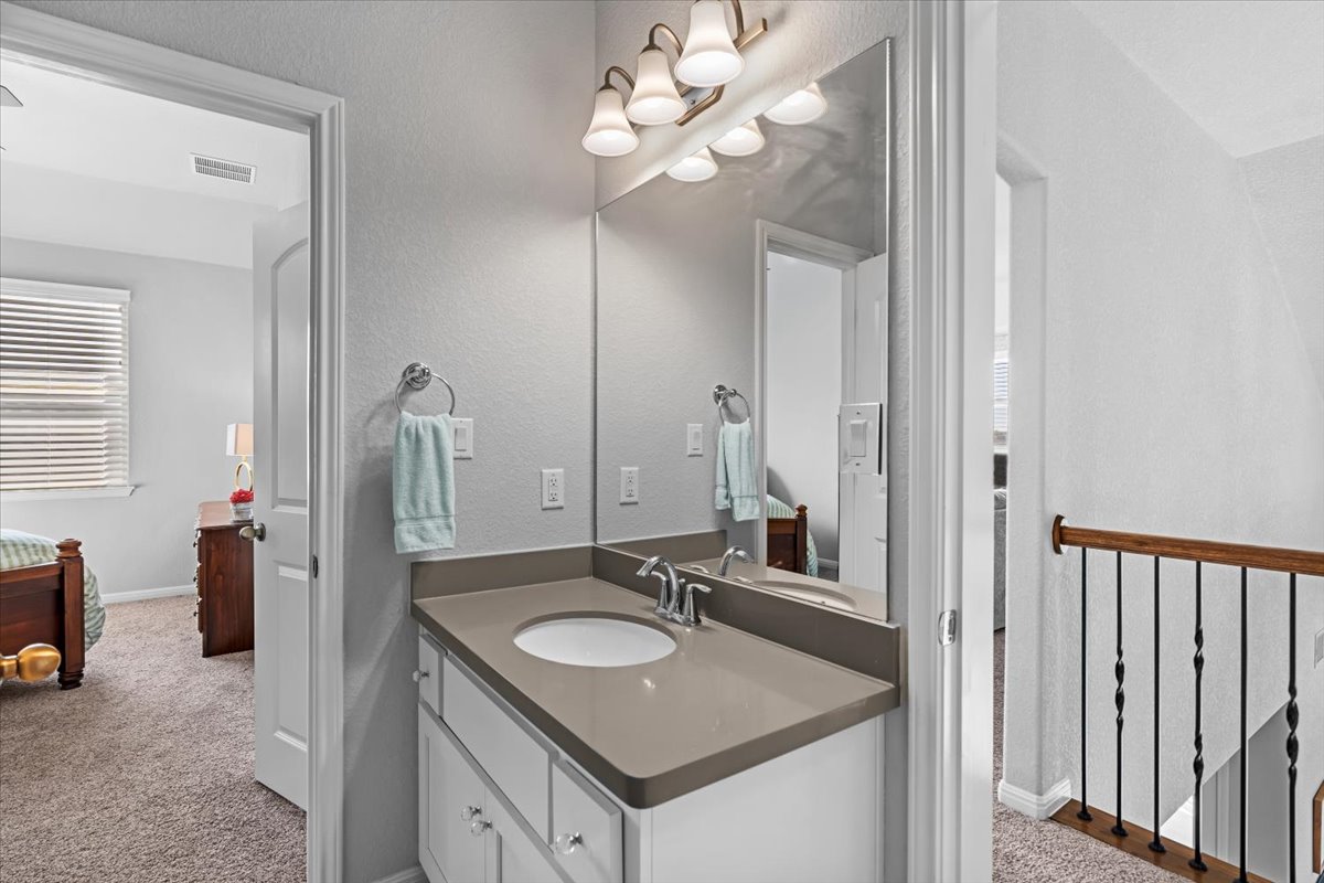 2733 Painted Sky Bend Leander, TX 78641 - Photo 29 of 35 a bathroom with a sink double vanity and a mirror