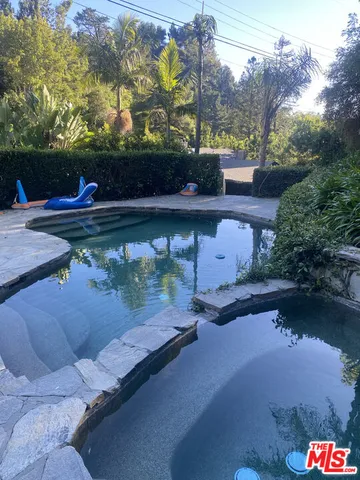 a view of a street with sitting area