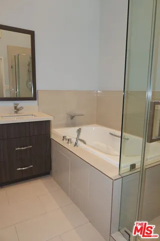 a bathroom with a sink and mirror
