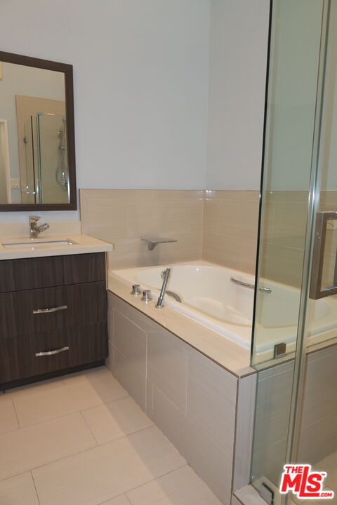 1617 Roscomare Road Los Angeles, CA 90077 - Photo 6 of 12 a bathroom with a sink and mirror