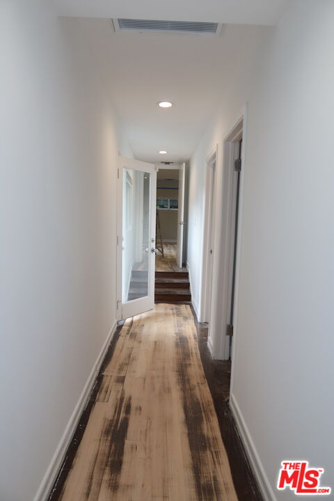 1617 Roscomare Road Los Angeles, CA 90077 - Photo 8 of 12 wooden floor in a gallery