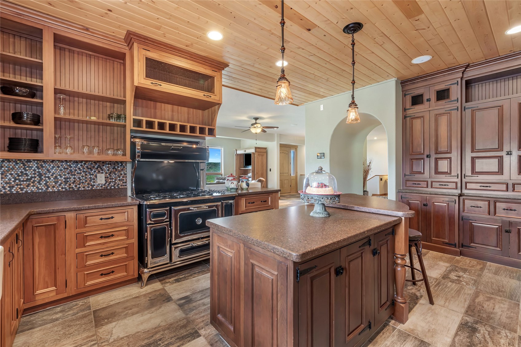 31485 Deerwood Ranch Road Steamboat Springs, CO 80487 - Photo 24 of 49 a kitchen with stainless steel appliances granite countertop a stove a sink and a refrigerator