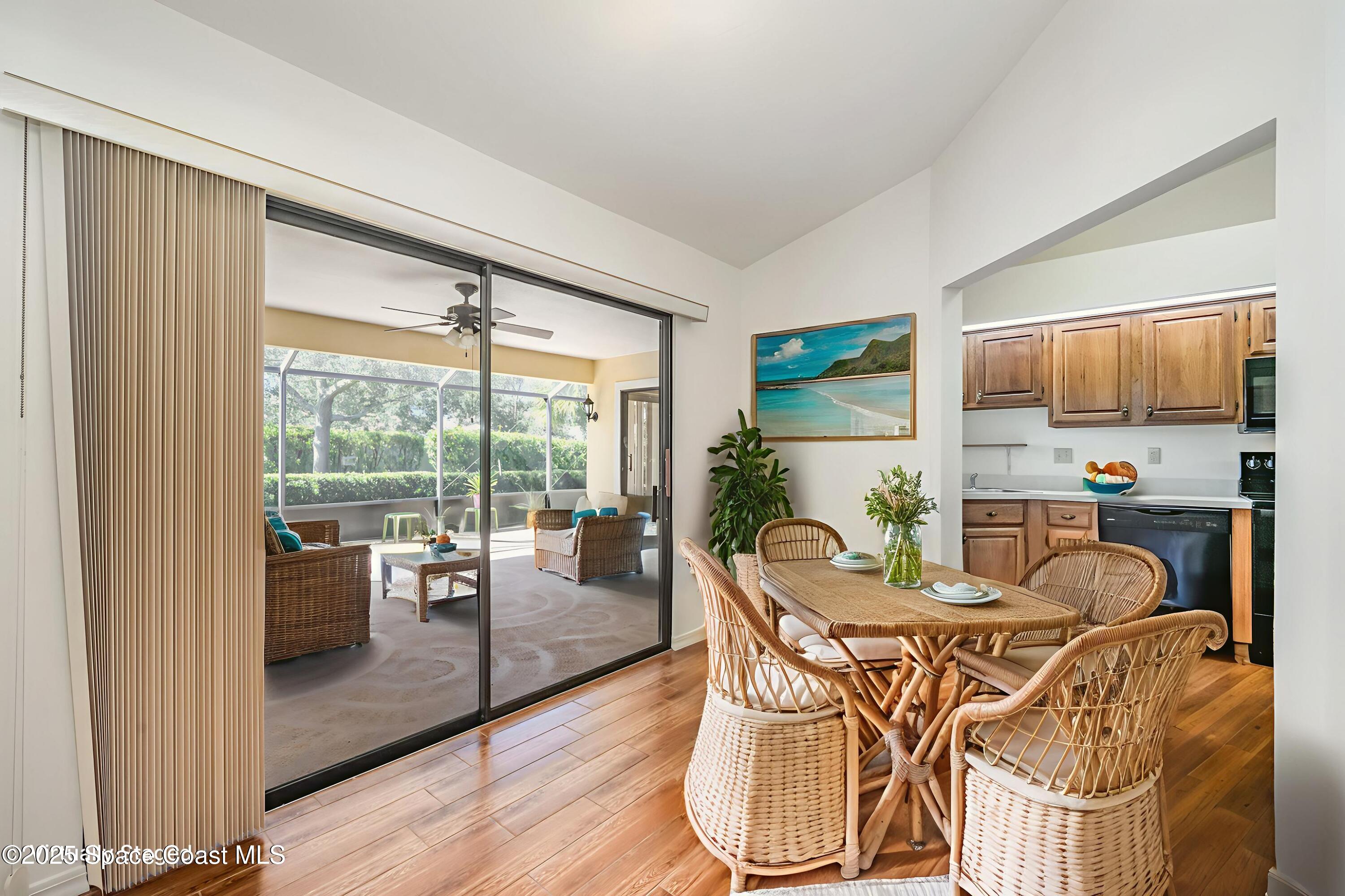 1652 Independence Avenue Melbourne, FL 32940 - Photo 12 of 38 a dining room with furniture water view and wooden floor