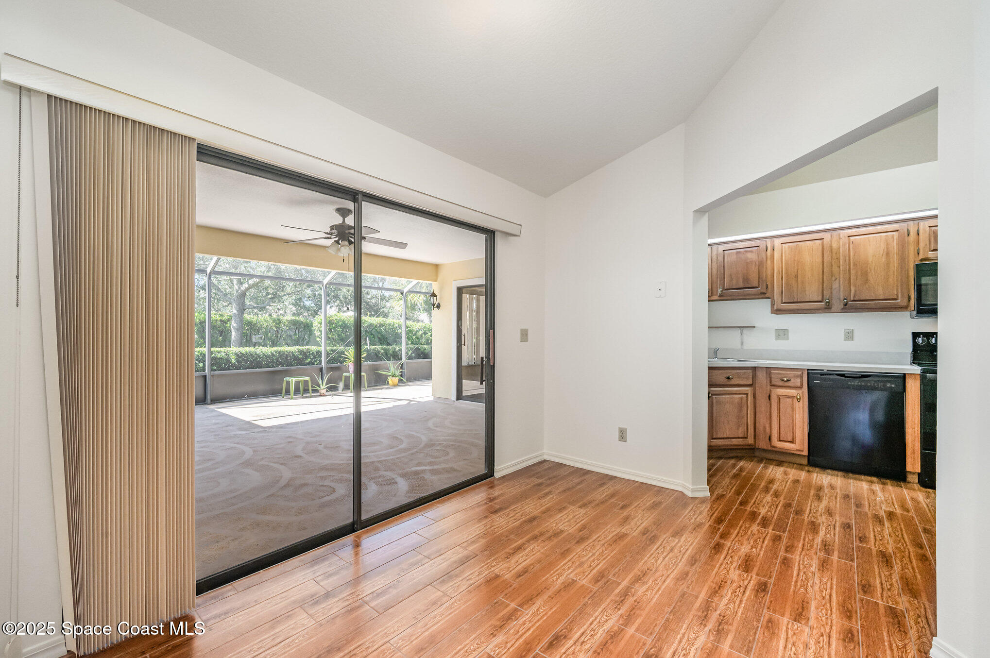 1652 Independence Avenue Melbourne, FL 32940 - Photo 13 of 38 a view of an empty room with a window and wooden floor