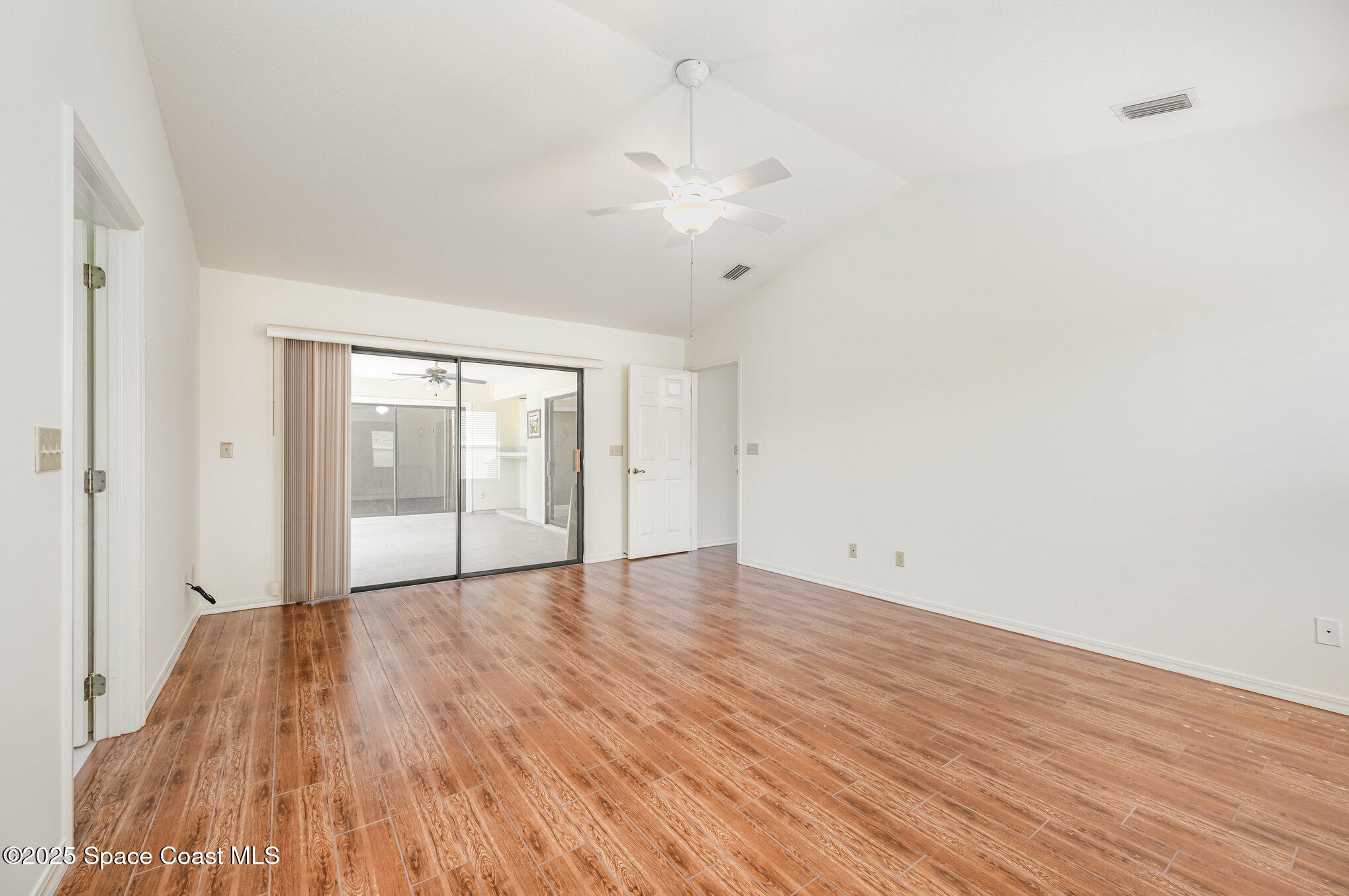 1652 Independence Avenue Melbourne, FL 32940 - Photo 16 of 38 wooden floor in an empty room