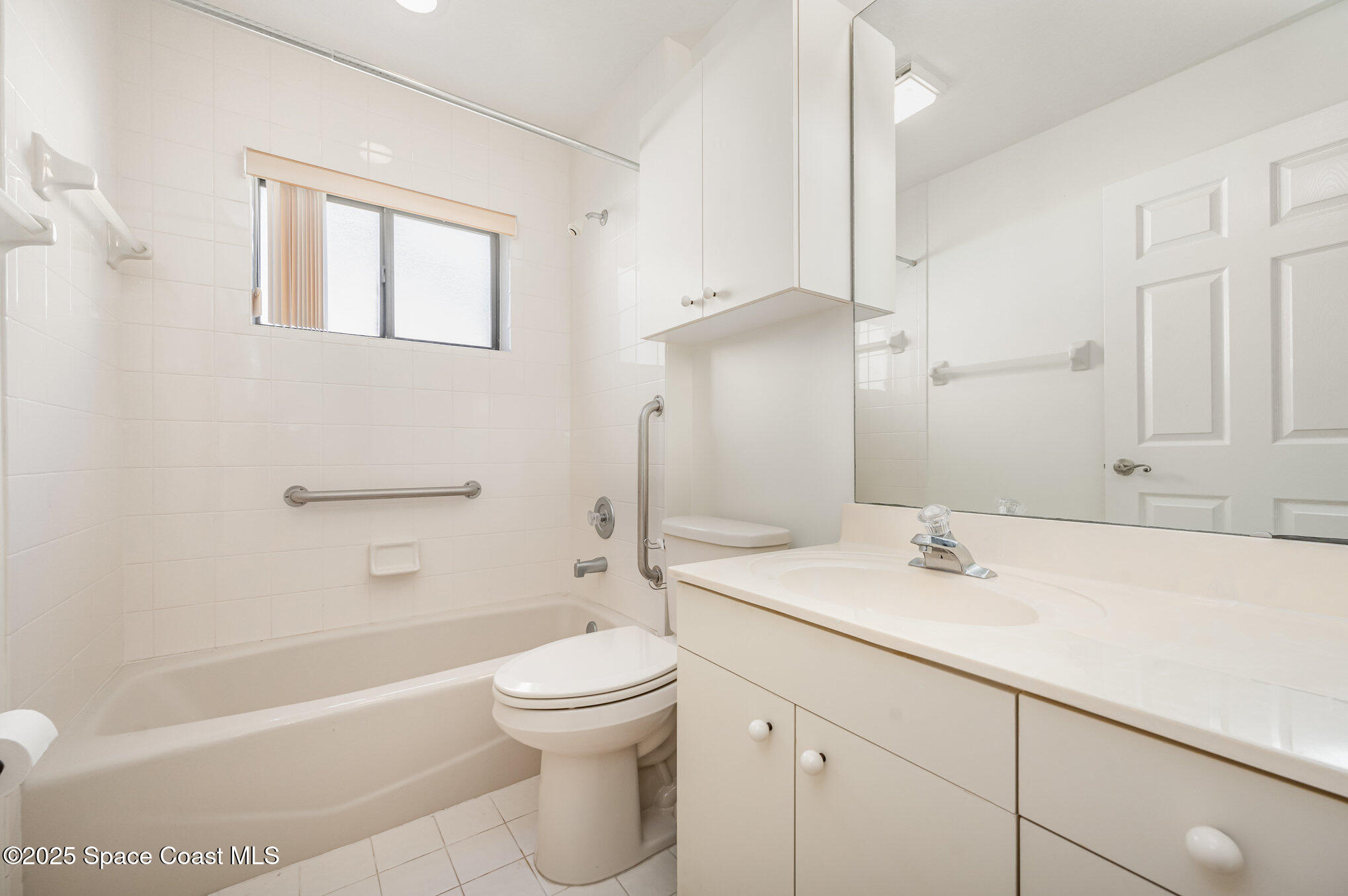 1652 Independence Avenue Melbourne, FL 32940 - Photo 21 of 38 a bathroom with a sink a toilet and shower