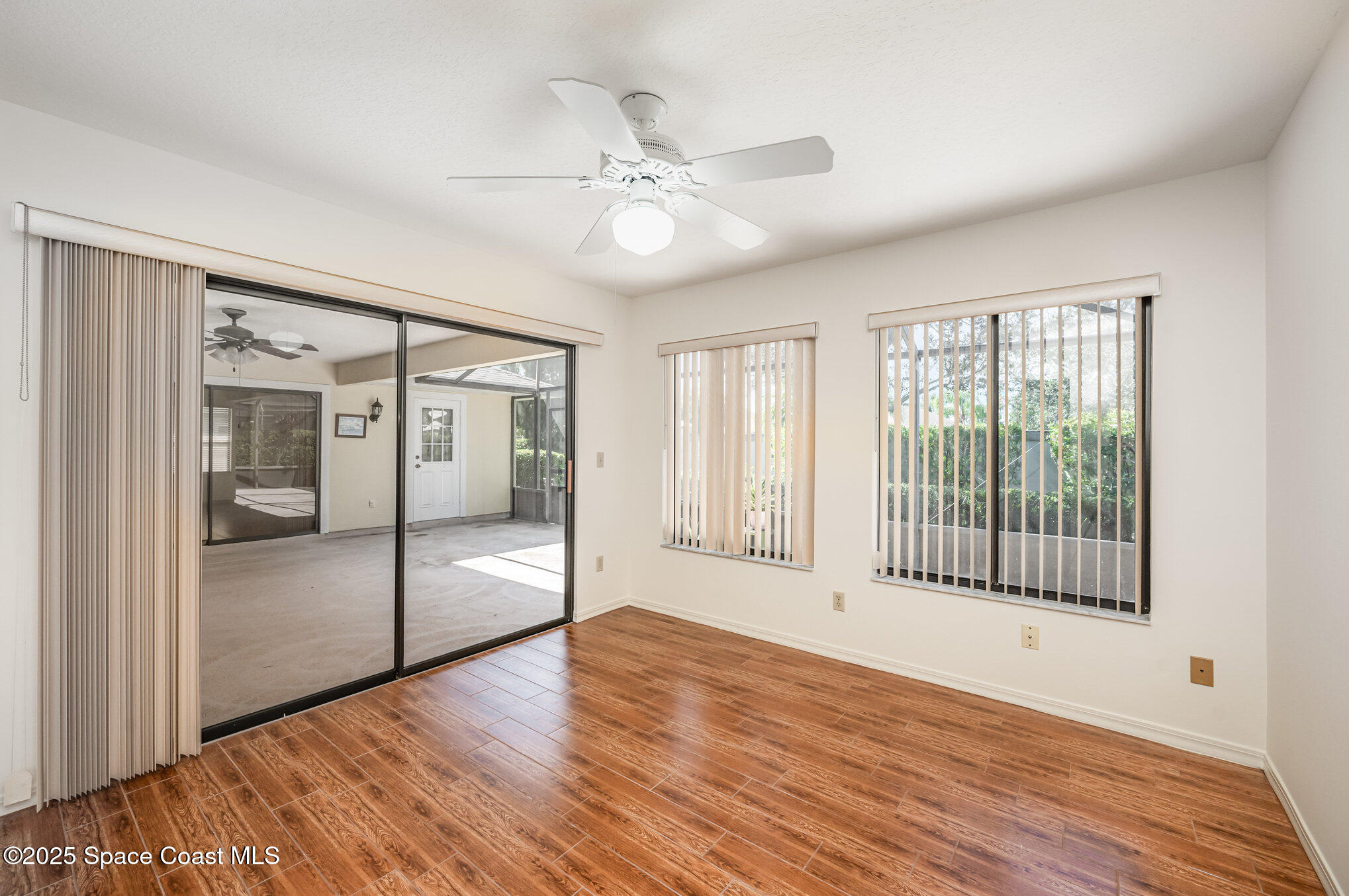 1652 Independence Avenue Melbourne, FL 32940 - Photo 22 of 38 a view of an empty room with window and wooden floor