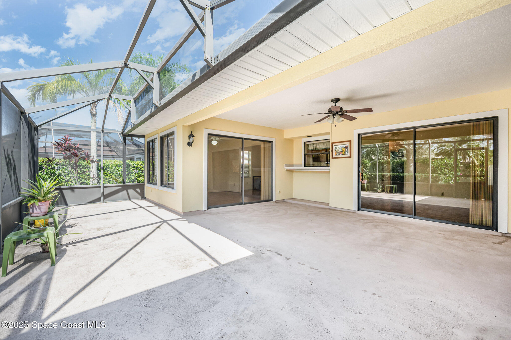 1652 Independence Avenue Melbourne, FL 32940 - Photo 25 of 38 a big room with potted plants and floor to ceiling window